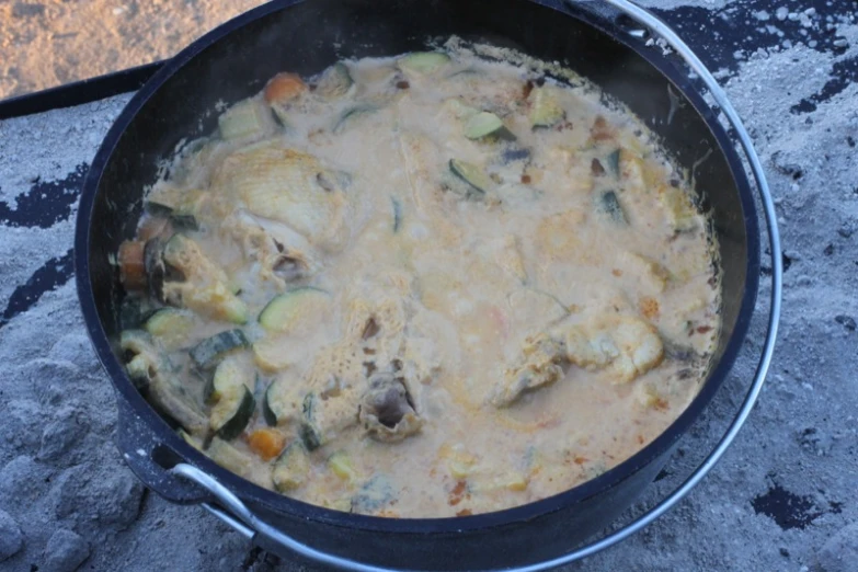 a pan of cooked vegetables and some meat