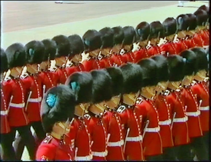 group of soldiers dressed in red and gold marching suits