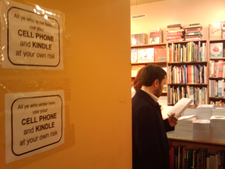 a man is reading in the book store