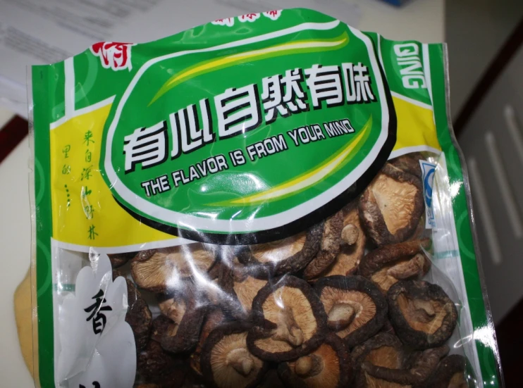 a bag of cooked fish rings with chopsticks