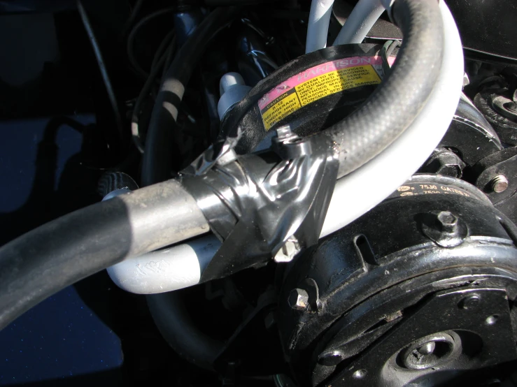 a close up of a vehicle engine and its hoses