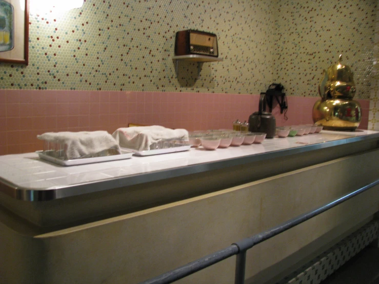 a pink and white counter in a kitchen