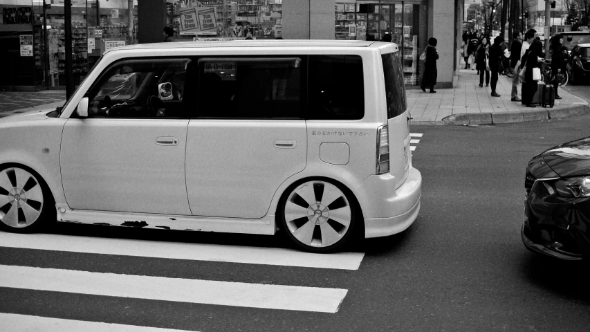 a small vehicle drives through the streets