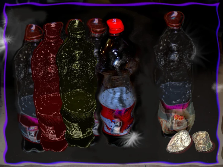 several bottles are displayed with the tops red, yellow and silver