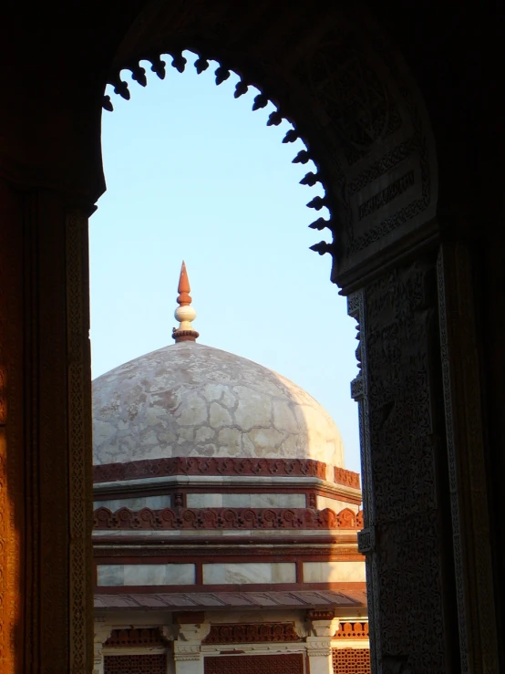 an intricate arch opening in to an oriental building