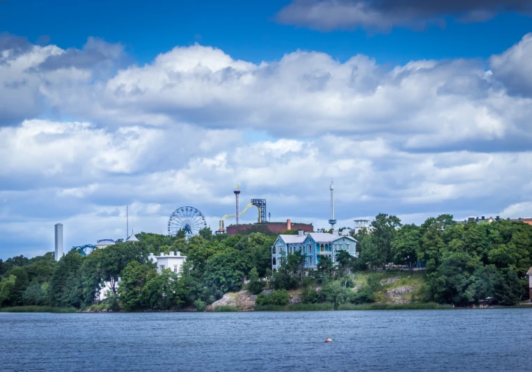 some houses are on a hill over looking the lake