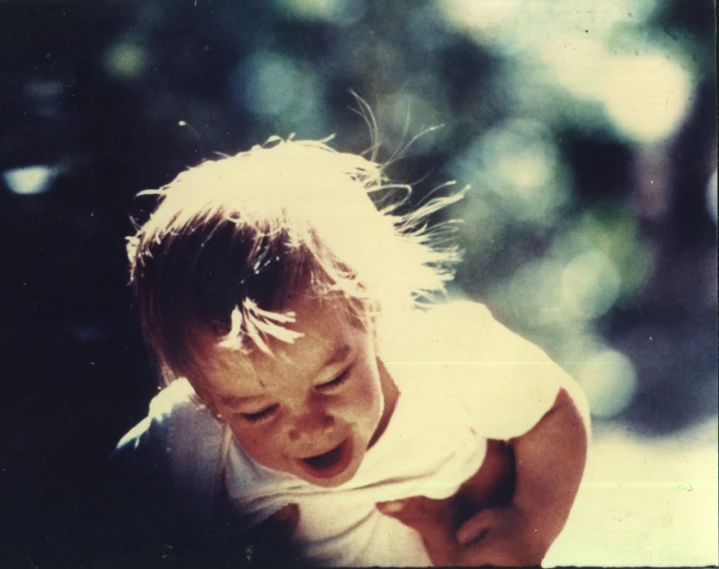 a small child has a messy face and hair