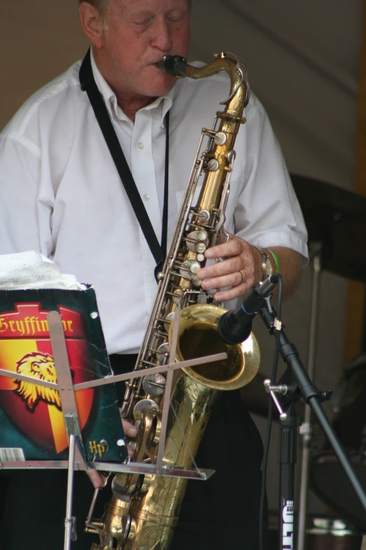 a man playing the saxophone while singing