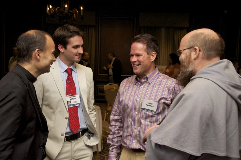 a group of men standing next to each other near each other