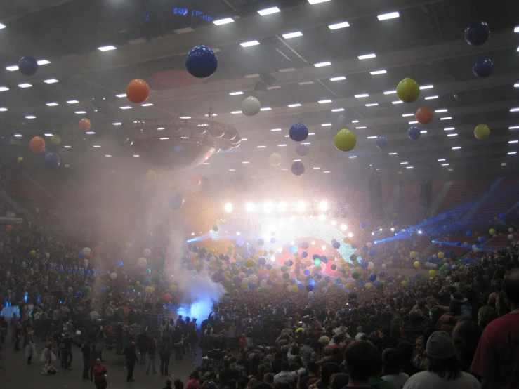an audience of people in the center of a hall