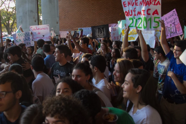 large crowd of people standing around each other outside