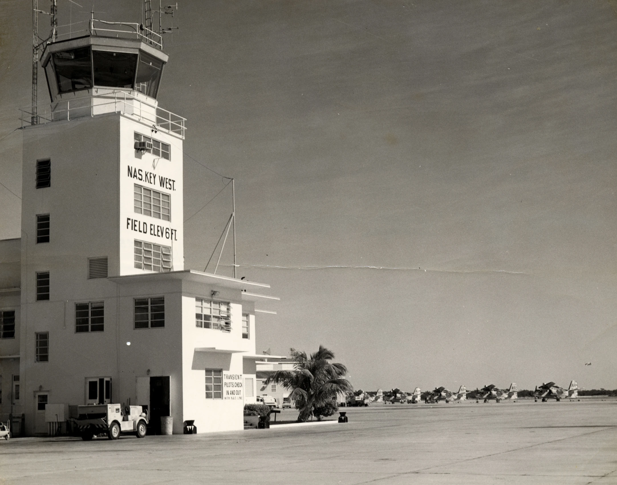 an air traffic control tower sits on the runway