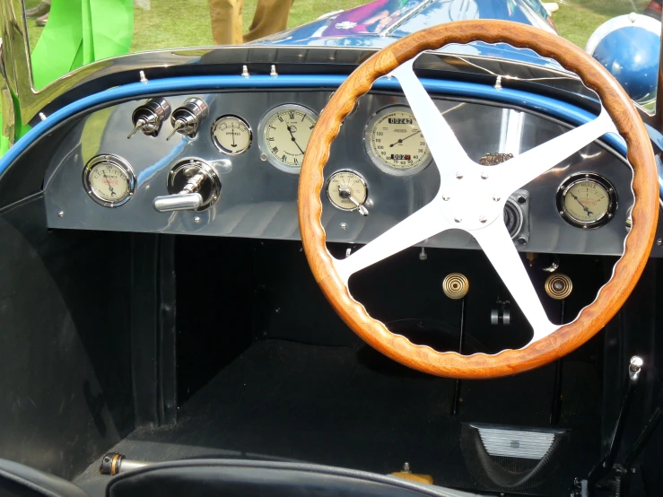 an old car dashboard with many gauges and other things