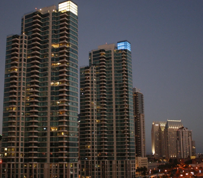 a row of building in a city at night