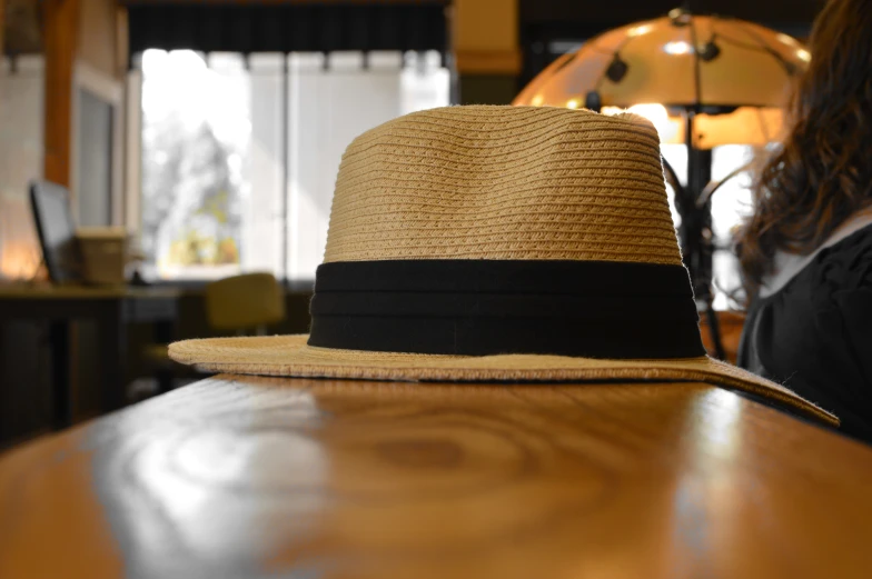 a hat is set on a counter with another hat on it