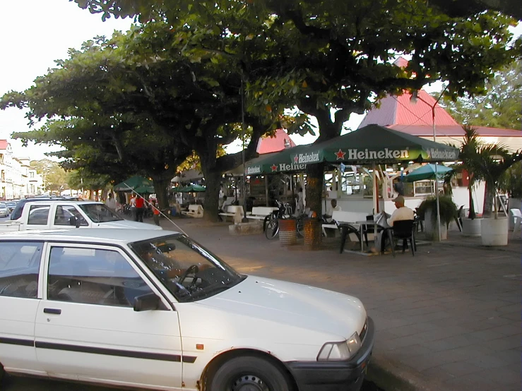 some cars parked on the side of a city street