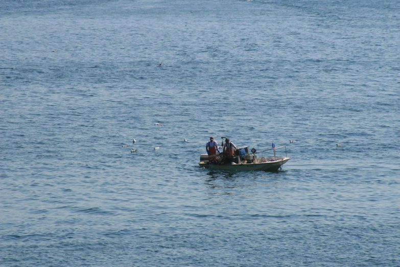 there are people that are on the boat in the water