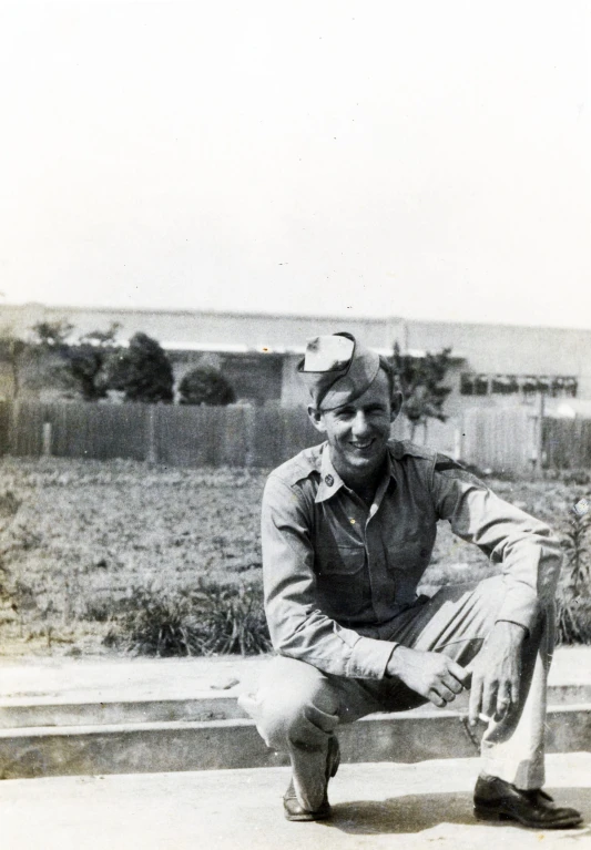 the man is posing for a picture in his uniform