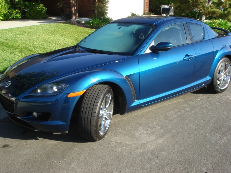 the blue sports car has two large tires