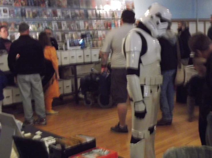 a group of people dressed as stormtrooper in an office