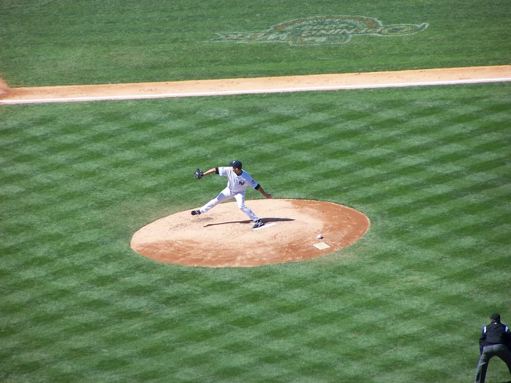 a baseball player getting ready to swing at the pitch