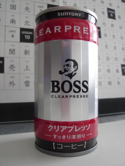 a tin can of boss clearfrisso is on the table