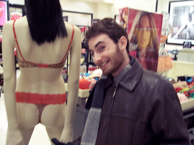 a man is posing for a picture in a store