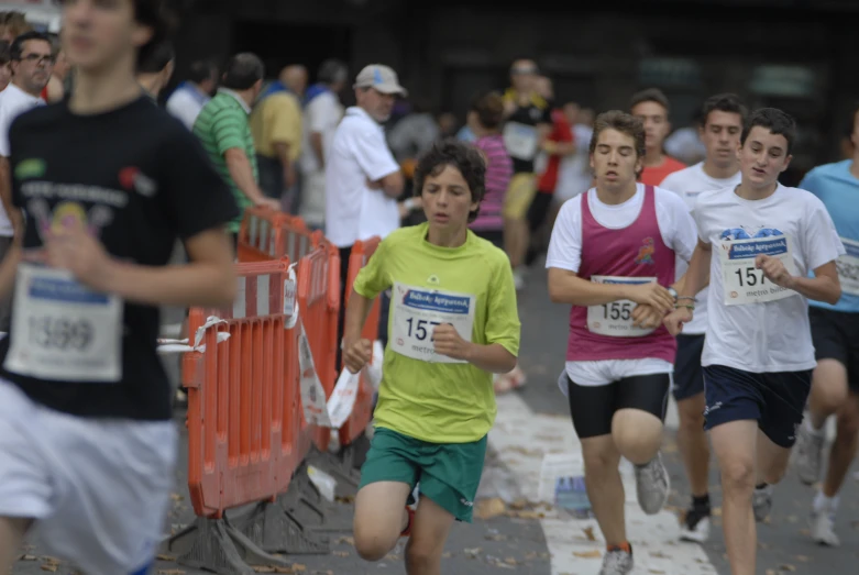 many young people running together on a track