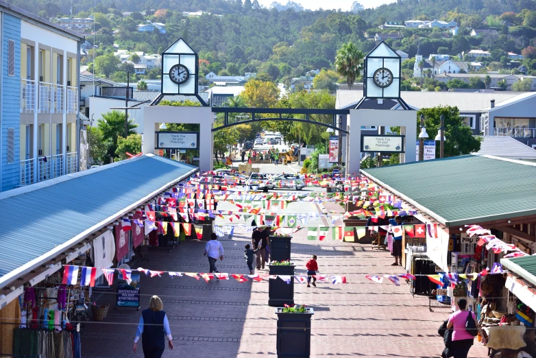 the crowd is standing under the awnings of the market