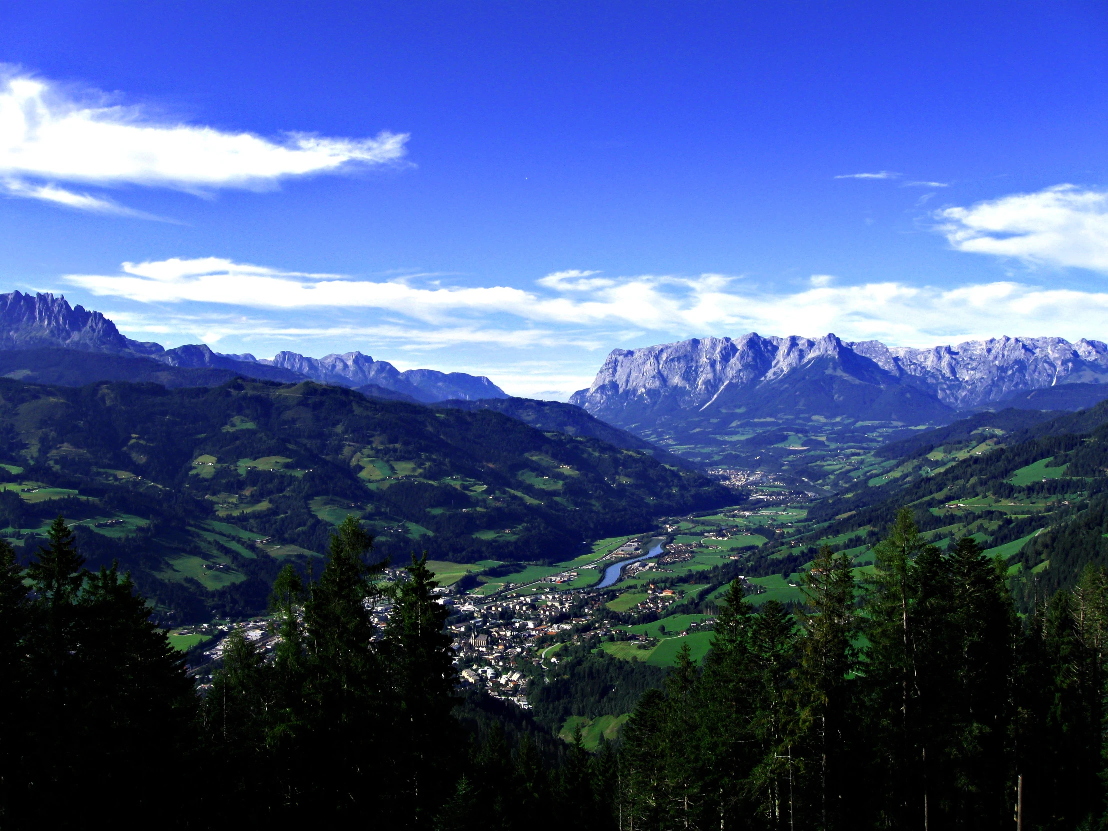 a view of a mountain range and mountains in the distance