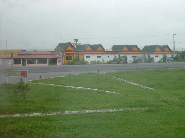 an open lot at the corner of a rural road