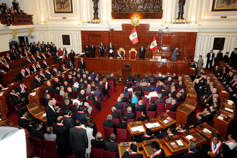 an assembly hall filled with men and women