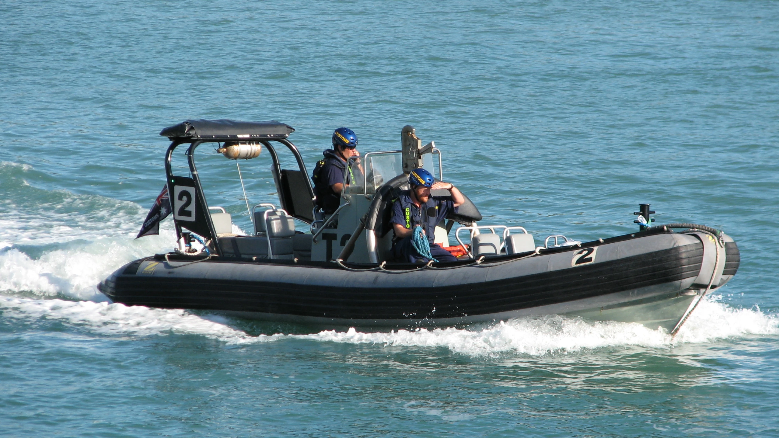 a boat full of people riding on the water