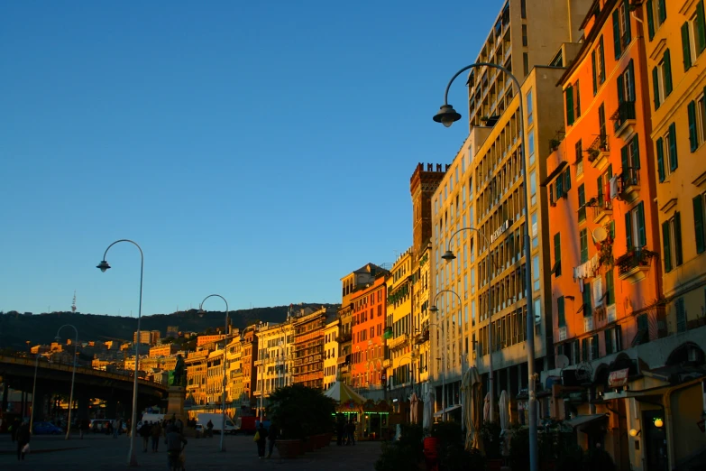 colorful buildings line a city street at twilight