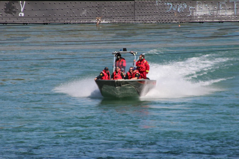 a group of people riding on top of a boat