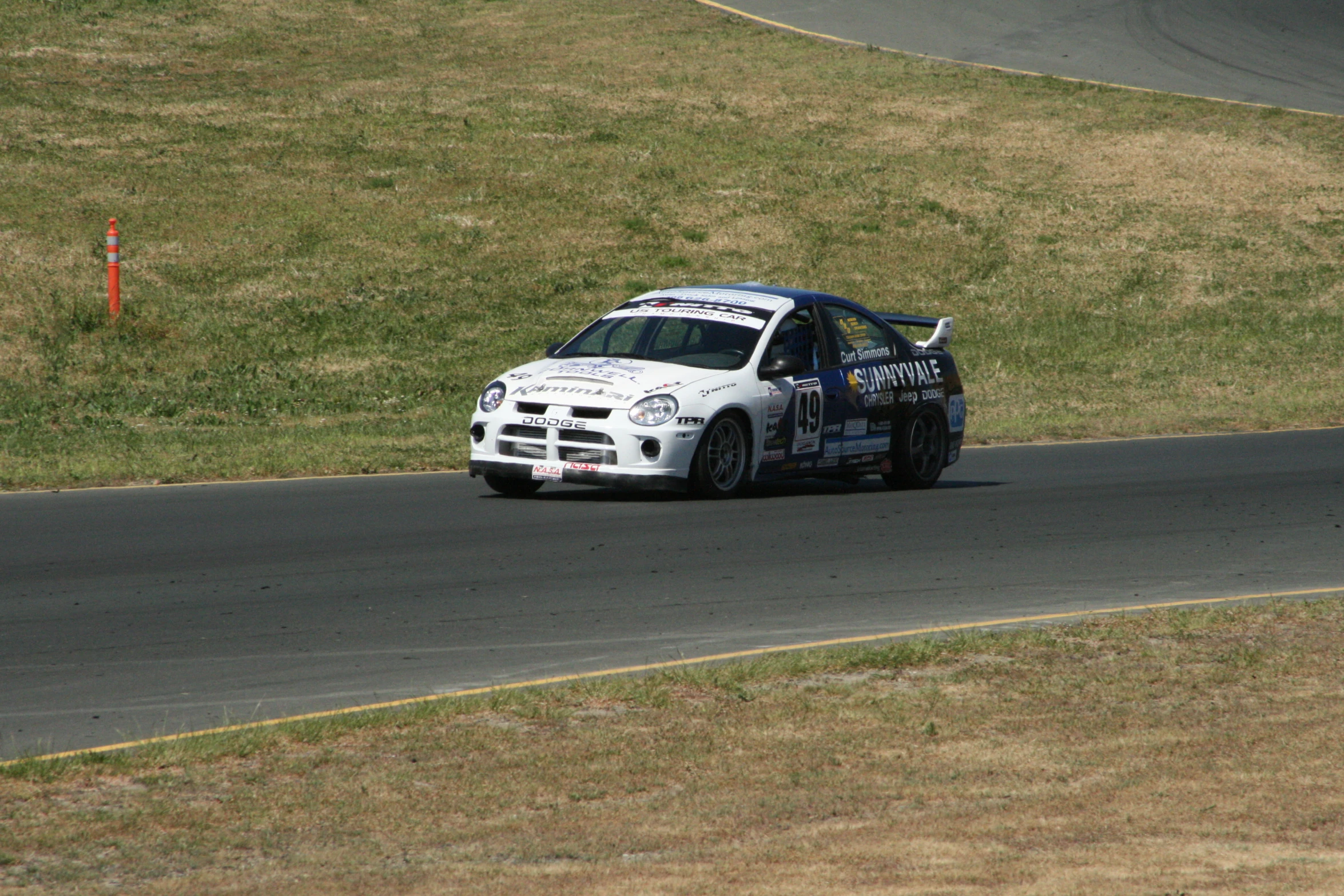 a car making a turn in a race