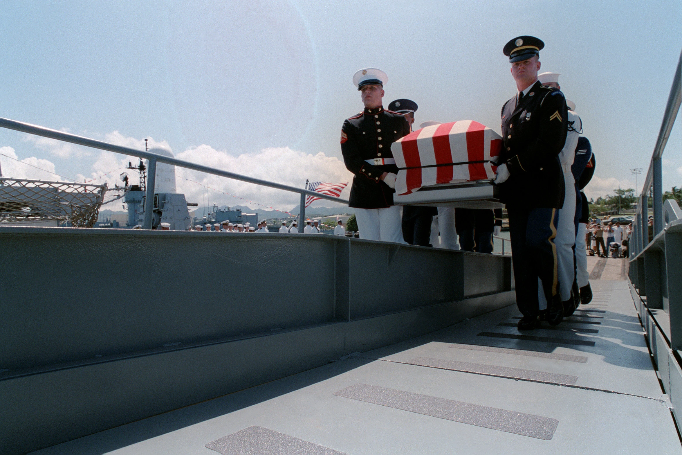 the soldiers are taking off from the ship with the flag