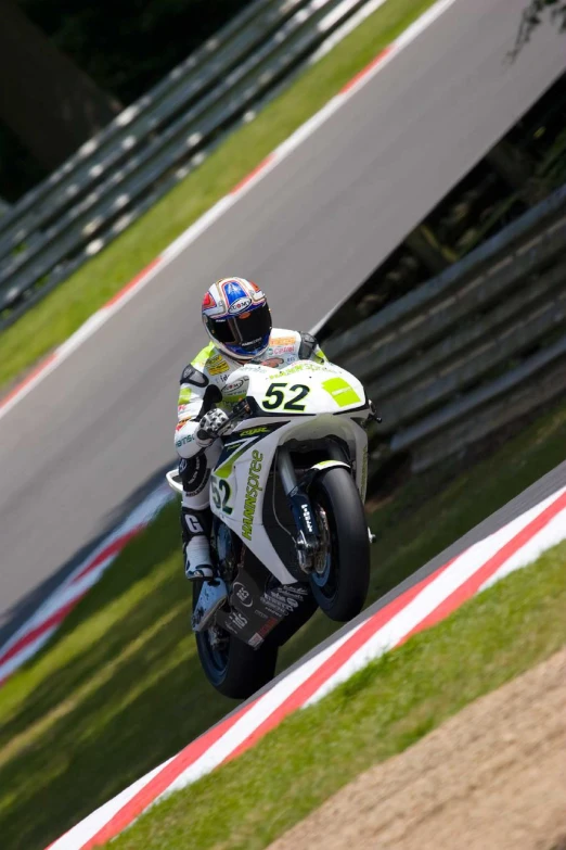 a person riding a motorcycle on a race track