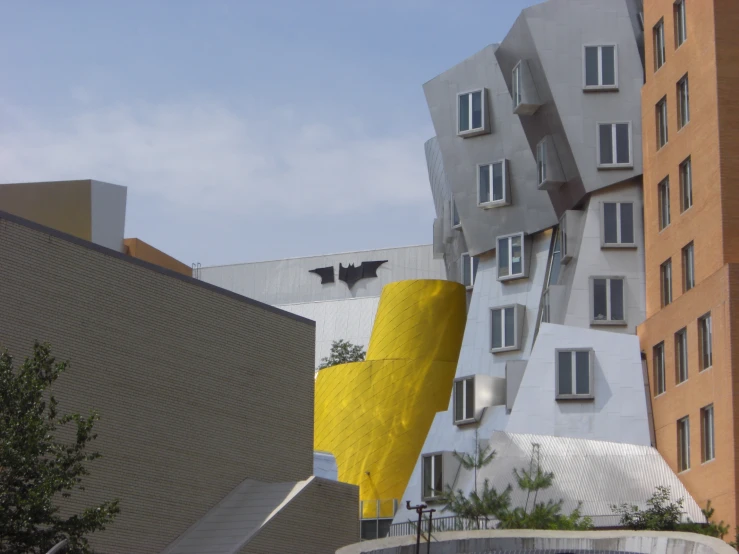 the tall buildings are covered in white and yellow material