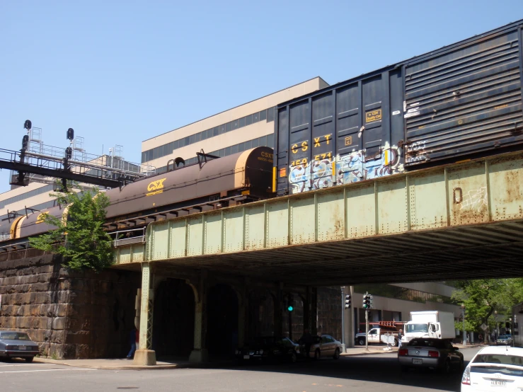 a train is seen going underneath an overpass