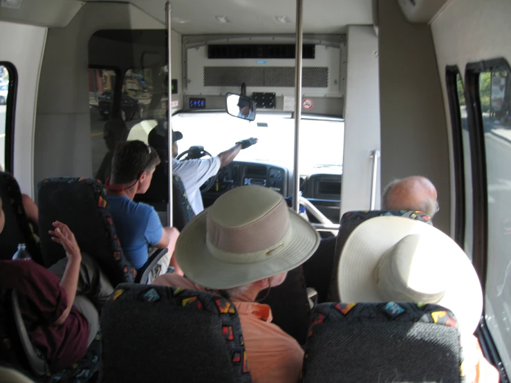 the inside of a bus is filled with people