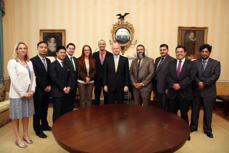 the six business people are posing for the camera