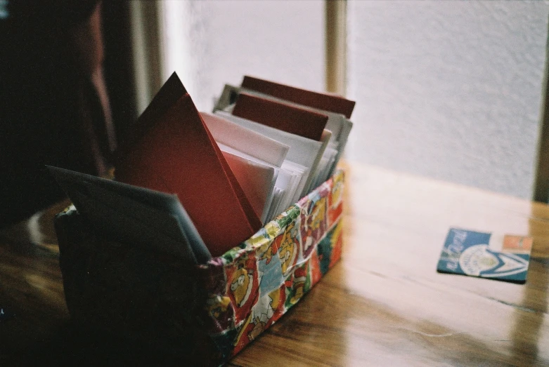 a desk with books in a magazine holder