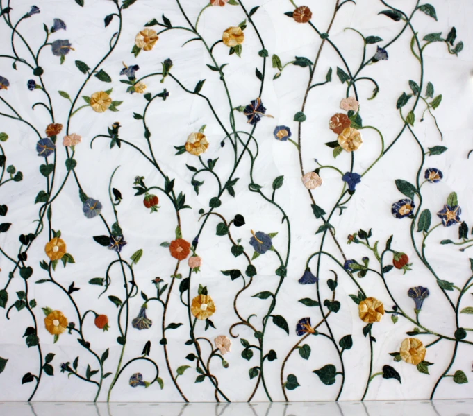 flower decoration on white wall with orange and blue flowers