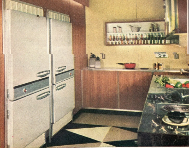 a po of a kitchen with cabinets, stoves, microwave and refrigerator