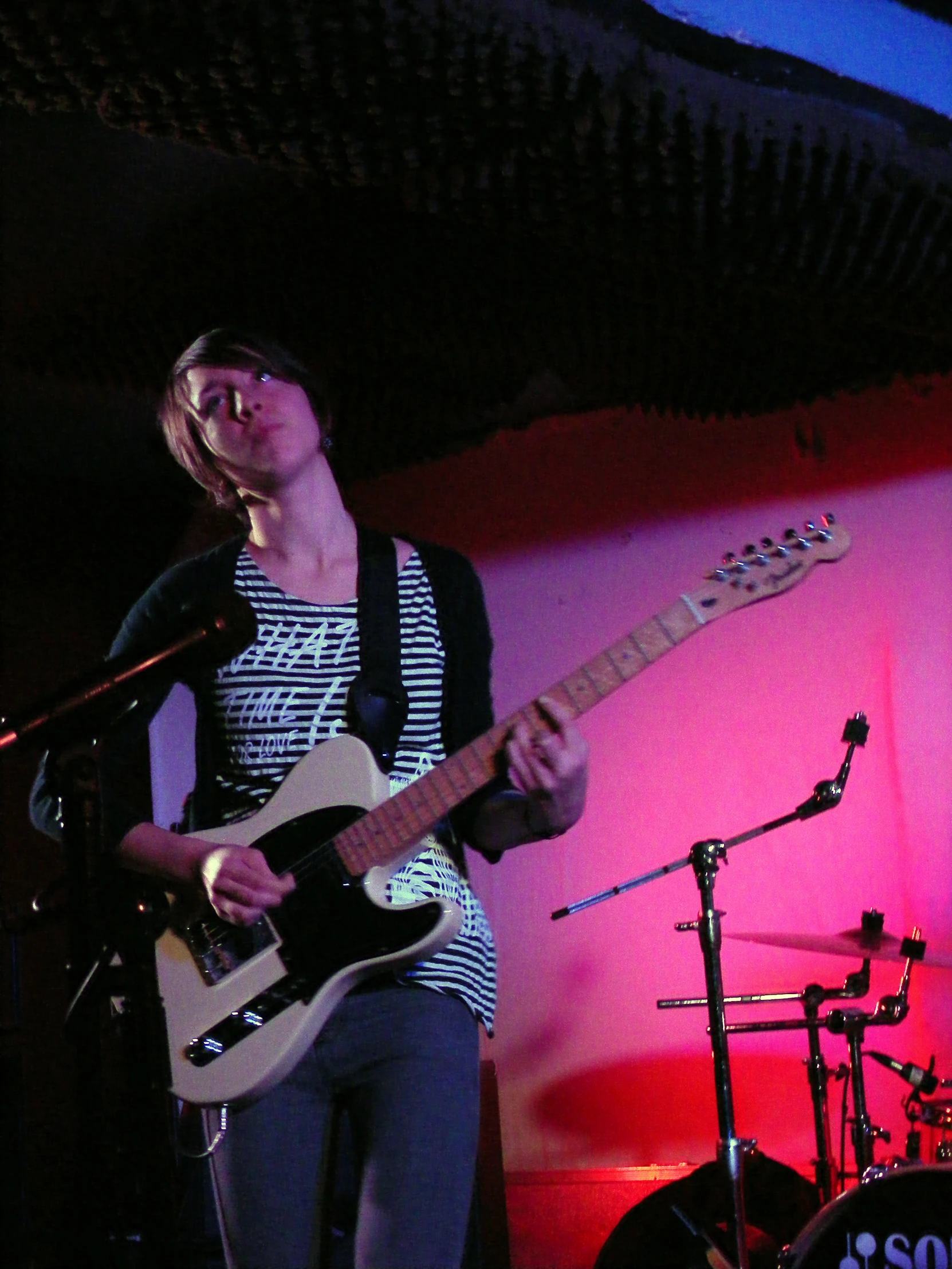 a person is playing an electric guitar