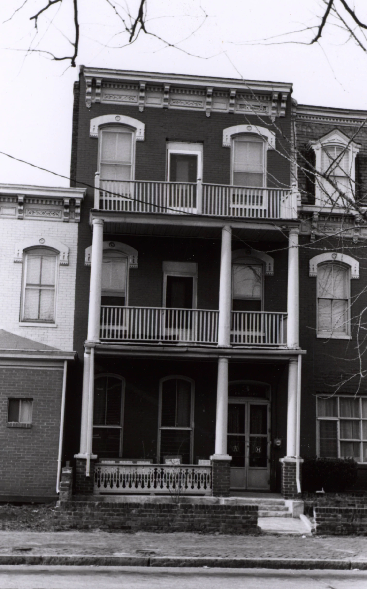 some buildings in a city with many balconies