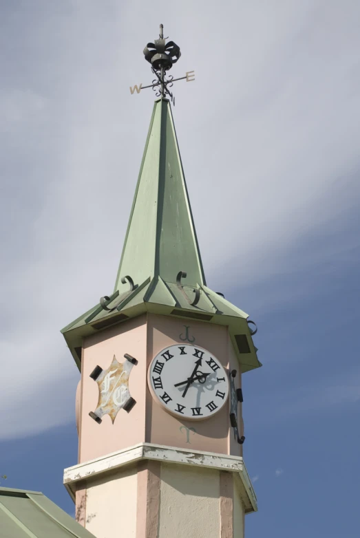 a small tower with a clock on the side