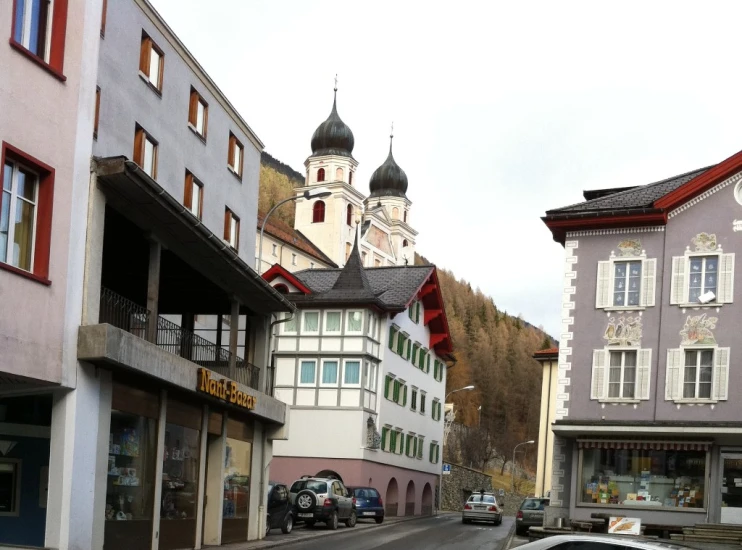 street view of buildings and a street car