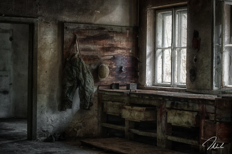 a very large wooden table sitting next to a window